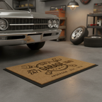 Personalized Dad's Garage coir doormat on a garage floor in front of a classic car
