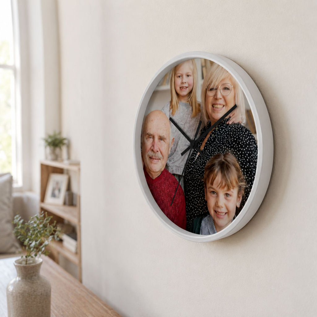 Custom photo wall clock with white frame displaying a family portrait