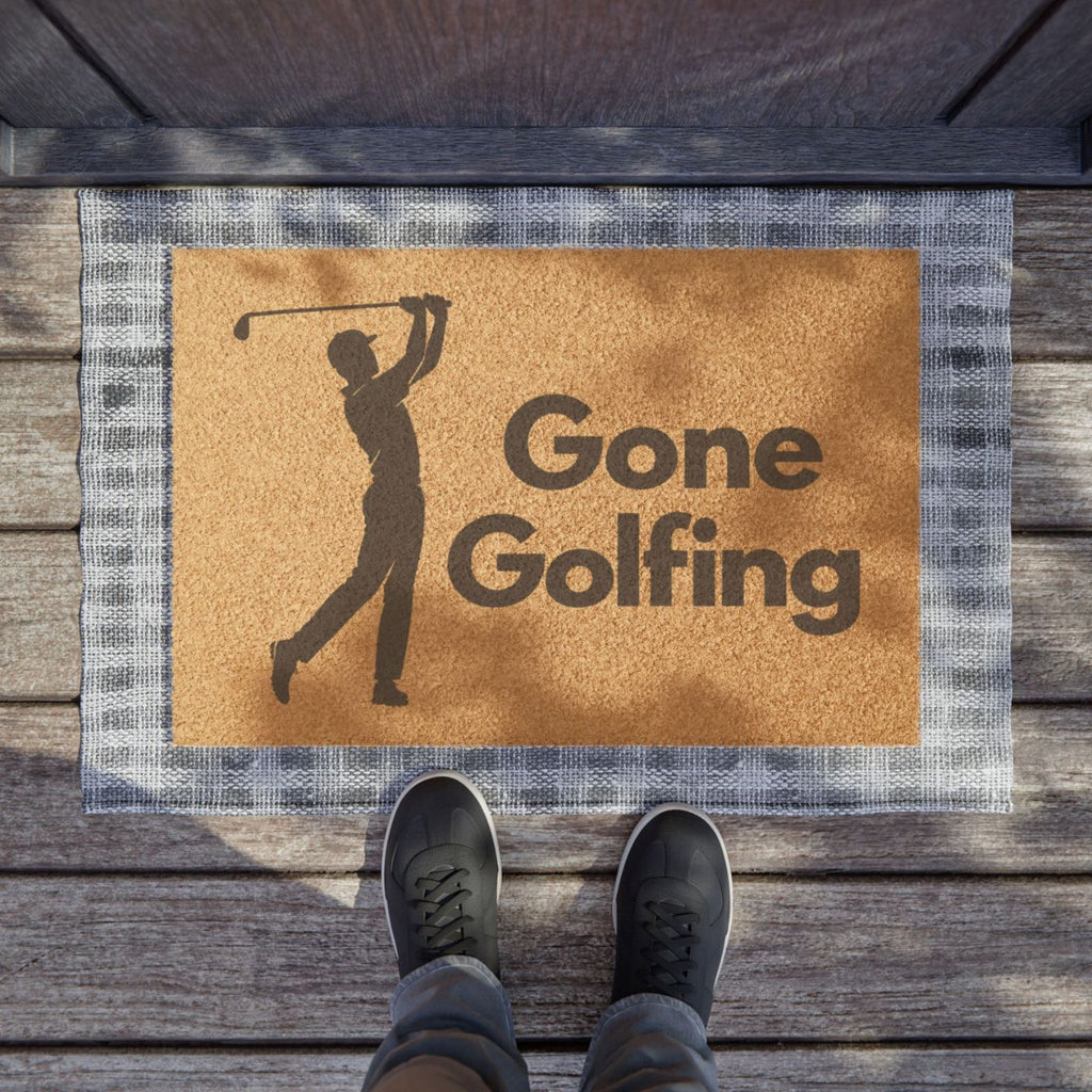Gone Golfing doormat with golfer silhouette at a wood-plank front entryway