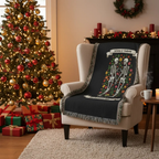 Personalized skeleton woven blanket on armchair beside Christmas tree and decorated fireplace