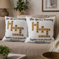 Two crossword family name pillows with grandkids' names styled on a couch