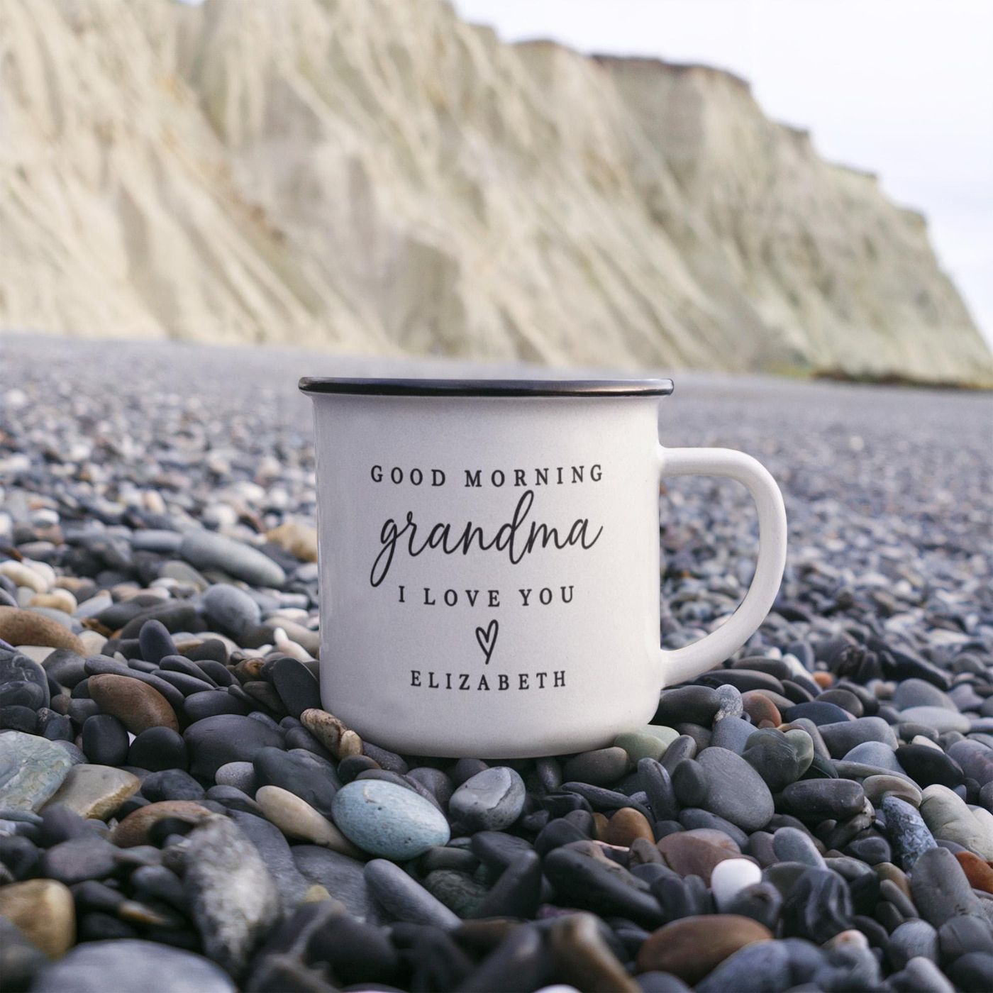 Personalized camp mug reading Good Morning Grandma I Love You Elizabeth, held lakeside
