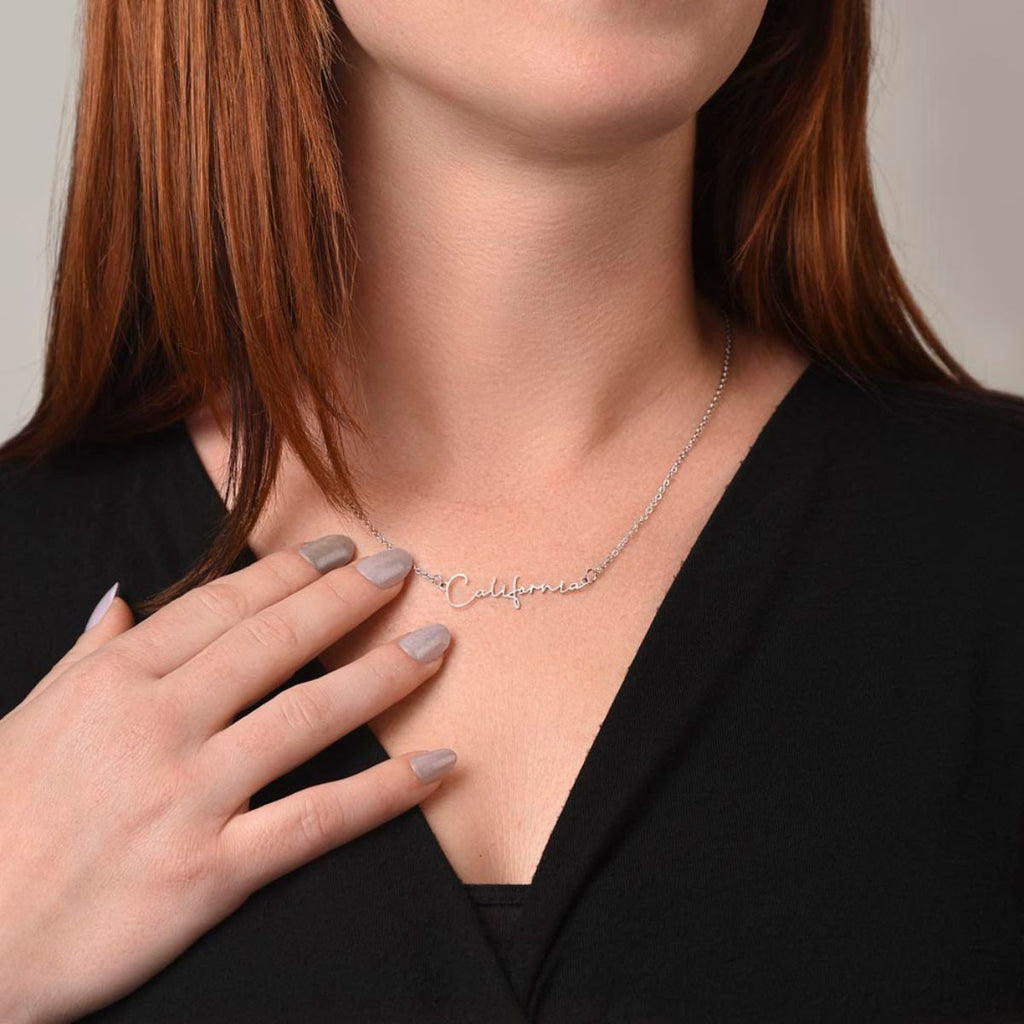 Woman wearing gold Signature Name Necklace with personalized name pendant